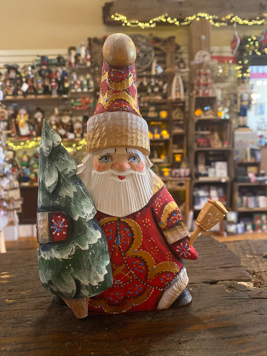 Wood-carved santa with tree - large