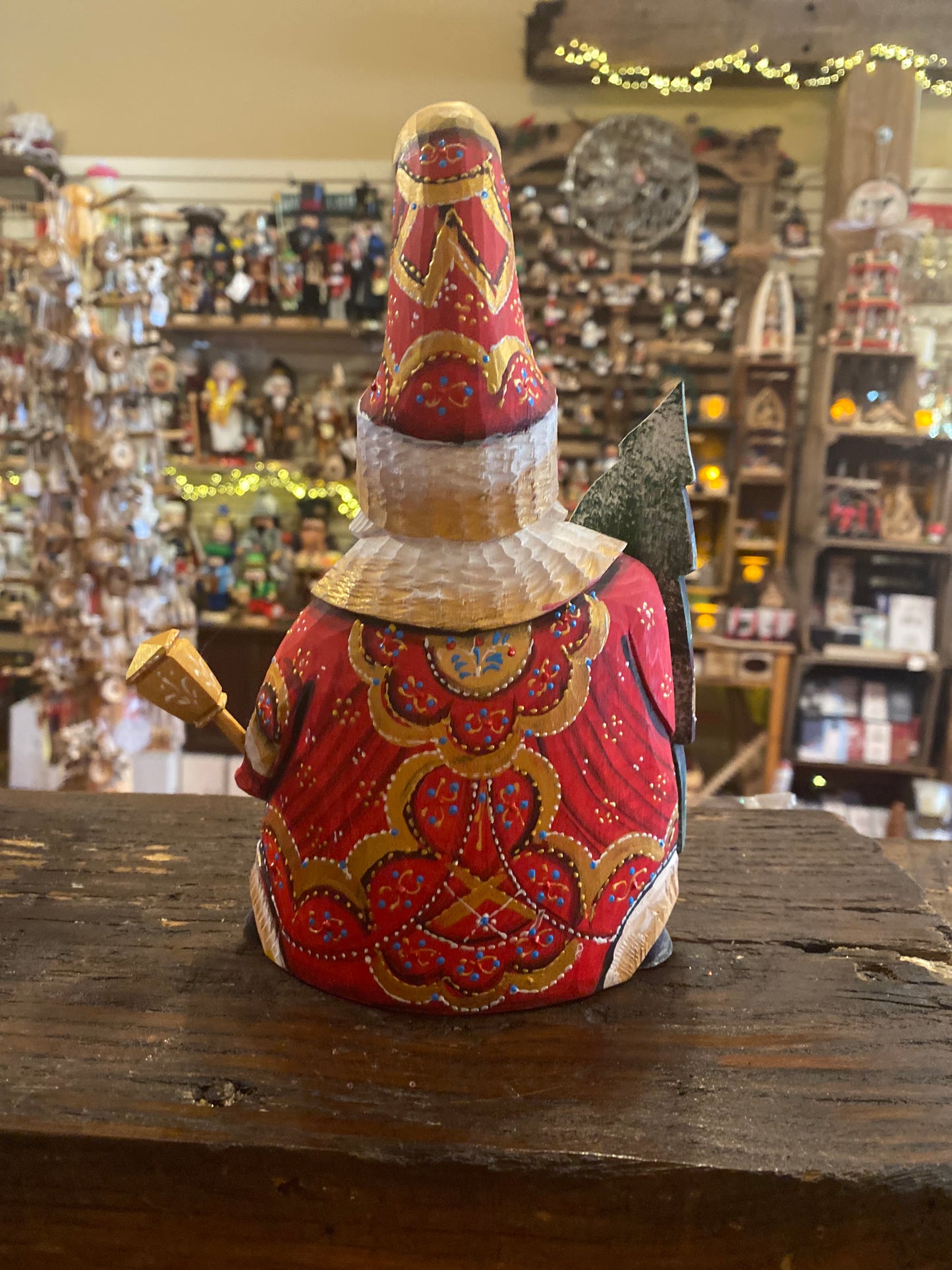 Wood-carved santa with tree - large