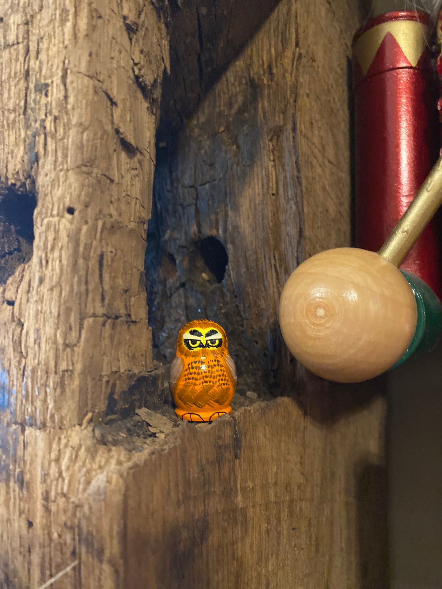 Tiny orange owl nesting doll