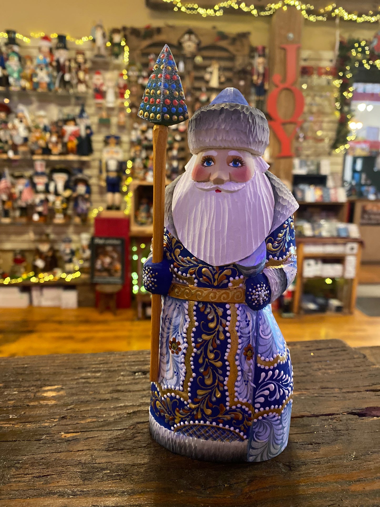 Blue wood-carved Santa figurine