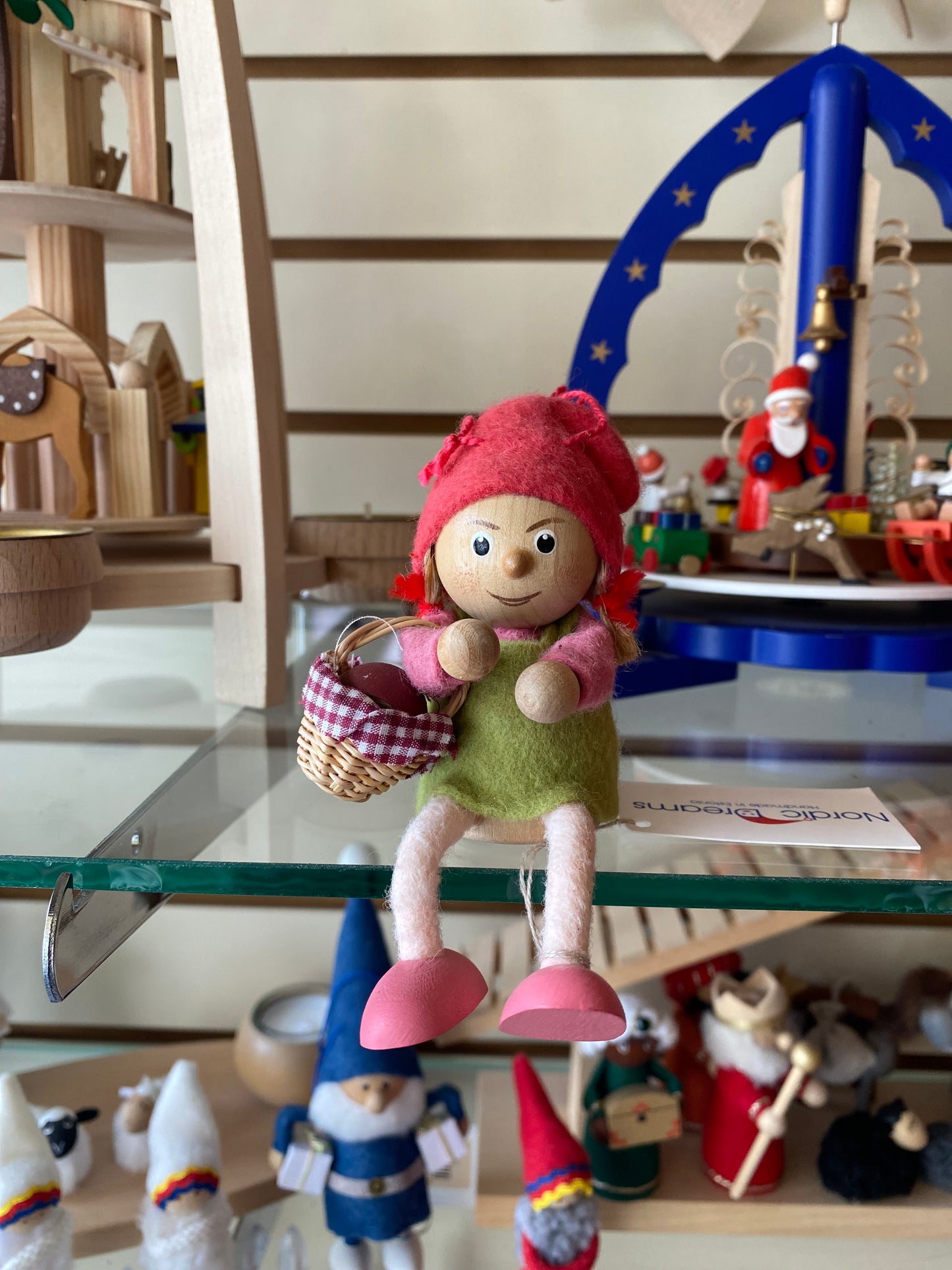 Girl in green sitting with basket